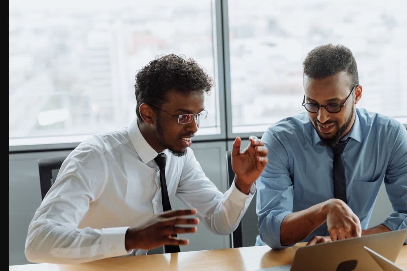 Business professionals in a focused consultancy conversation.
